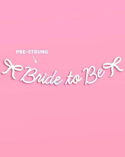 xo, Fetti Bride to Be Bow Banner Iridescent Foil + Pink Glitter , 5 Ft. | Bachelorette Party Decoration, Tying the Knot Bride Bach Decor, Bridesmaid Favor, Engagement Gift, Bridal Shower Supplies, Photobooth Backdrop