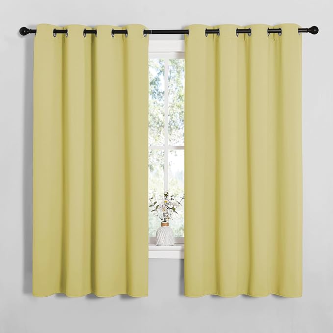 NICETOWN Bedroom Curtain Panels Blackout Draperies, Thermal Insulated Solid Grommet Blackout Curtains/Drapes (Paler Yellow, 1 Pair, 55 by 68-inch)