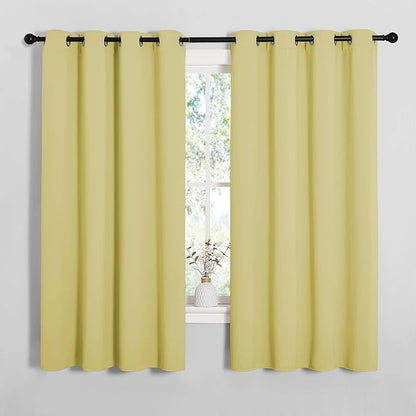 NICETOWN Bedroom Curtain Panels Blackout Draperies, Thermal Insulated Solid Grommet Blackout Curtains/Drapes (Paler Yellow, 1 Pair, 55 by 68-inch)