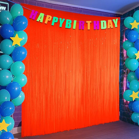 Glow in The Dark Party Supplies, 2 Pack Macaron Orange Foil Fringe Curtains, 3.3 x 6.6 ft Blacklight Reactive Fluorescent Tinsel Backdrop Neon Luminous Streamers for Birthday Photo Booth Prop