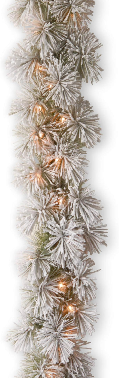 National Tree Company 9 ft Pre-Lit Snowy Bristle Pine Artificial Christmas Garland, Christmas Decoration with 70 Clear Lights, 75 Tips, Green